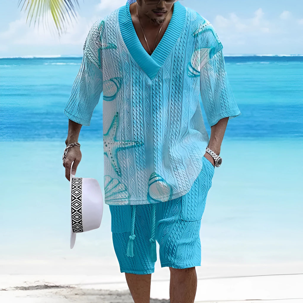 Man wearing a loose-fitting light blue short sleeve top and matching casual shorts from a two-piece suit set.