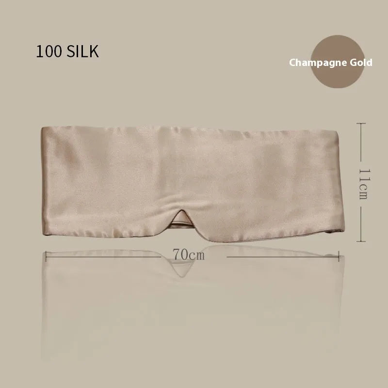 A mulberry silk sleep mask in champagne gold colour, shown lying flat.