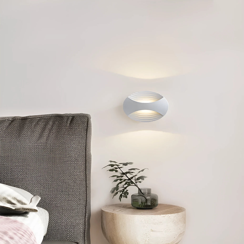 Modern aluminium wall lamp in metallic finish with wall-mounted design for bedroom bedside lighting