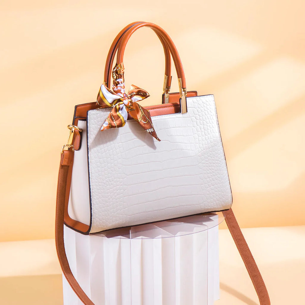 Milky white women's shoulder handbag with horizontal square shape showing internal organiser compartments