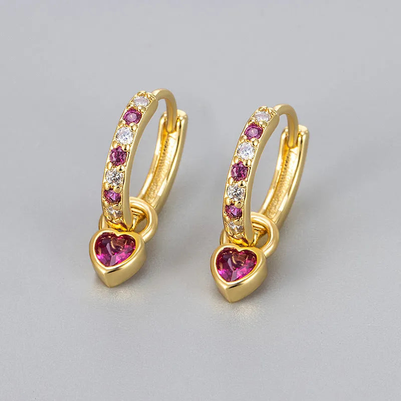 Gold-coloured clip-on earring for women with a heart-shaped drop featuring a pink zircon stone.