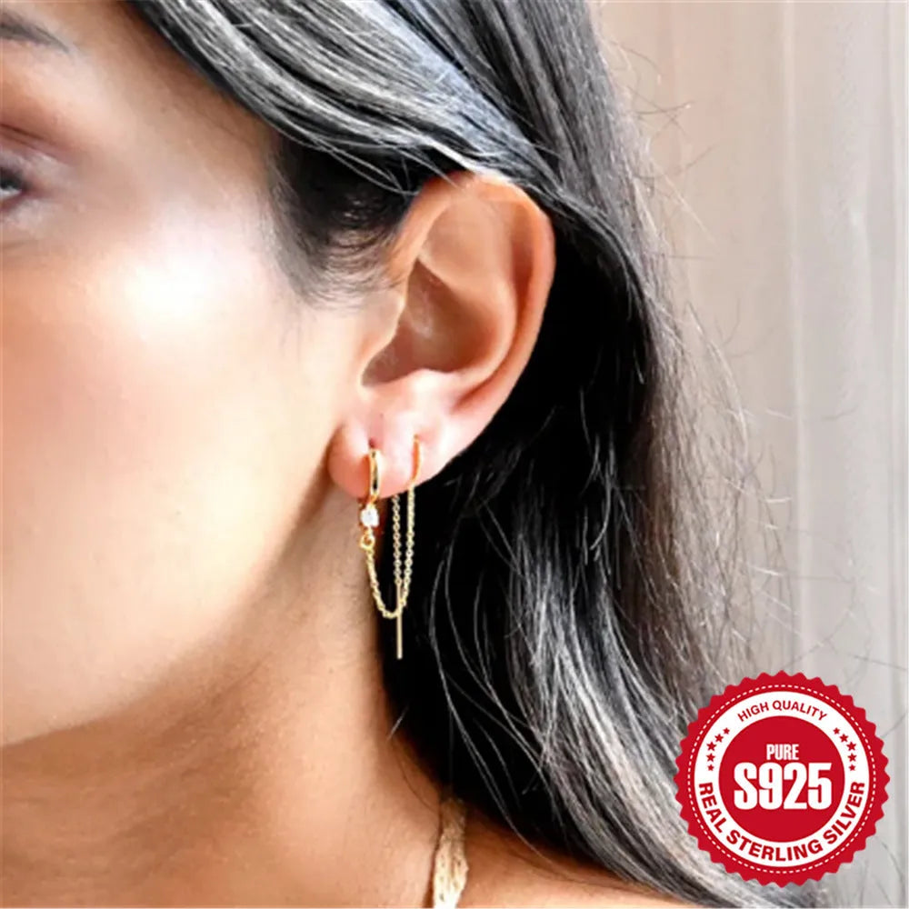 S925 sterling silver ear stud with gold electroplated flower and dangling tassel chain design.