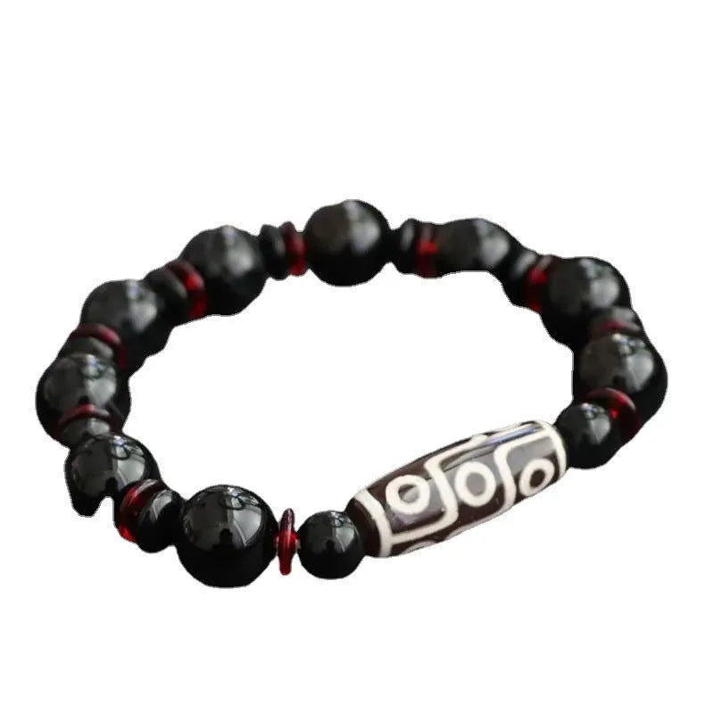 Black agate Dzi bead bracelet with hand-woven construction and 11mm geometric beads