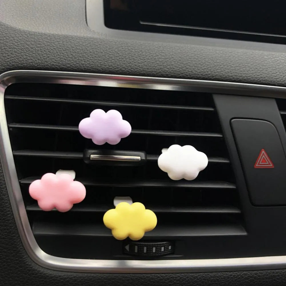 Resin Baiyun cartoon car air freshener clip in pastel colours on a car vent.