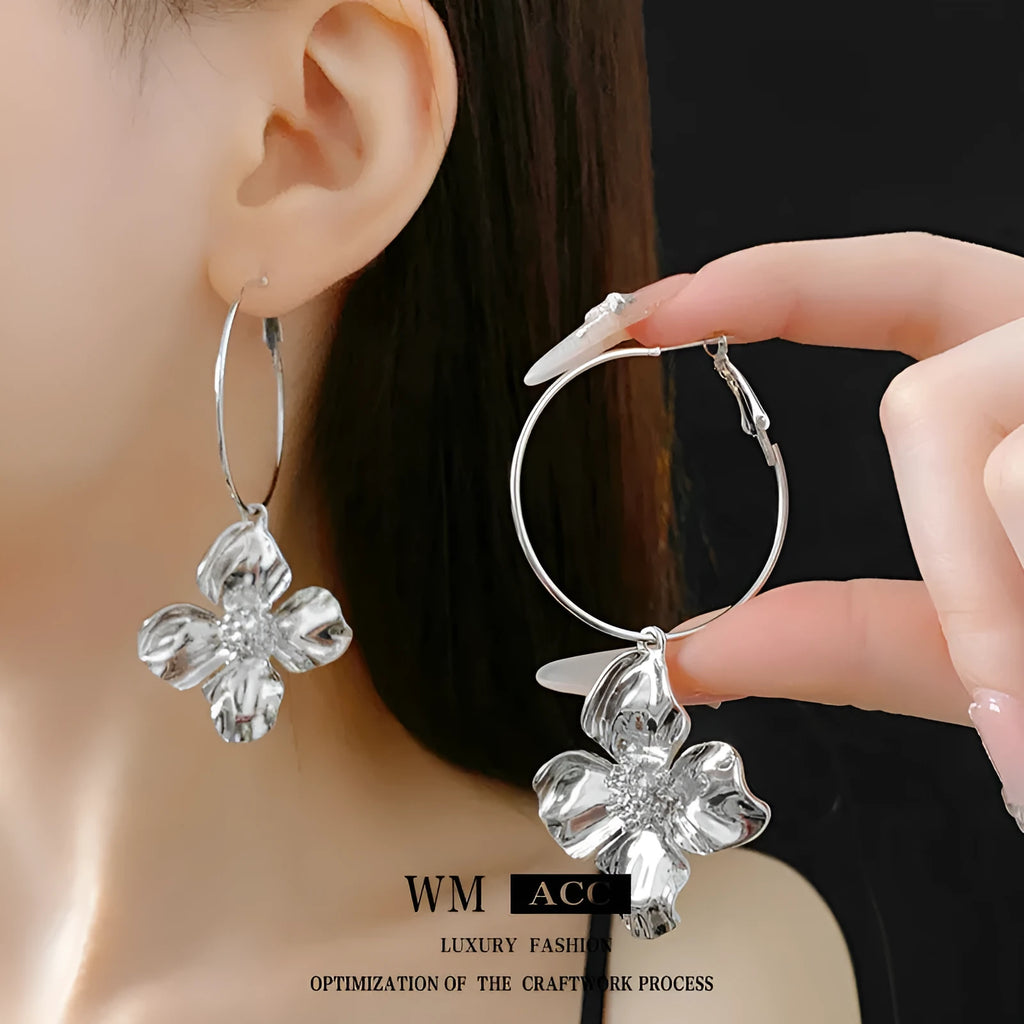 Silver Needle Metal Flower Earrings showing geometric floral pendant on long needle post in gold or silver.