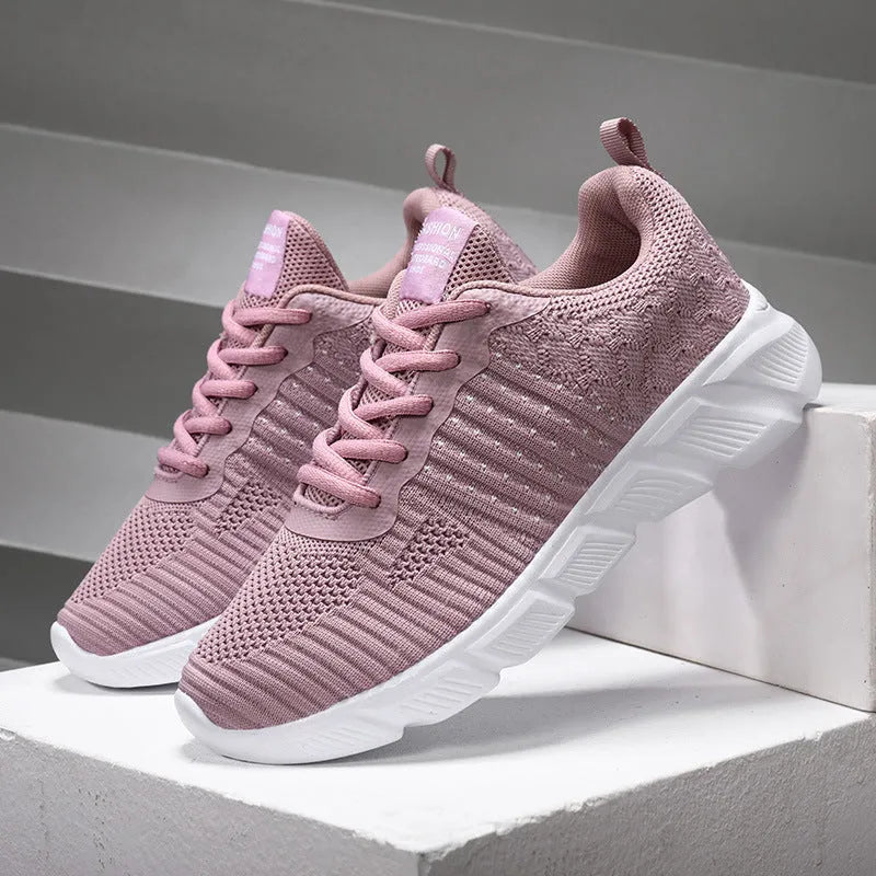 Pair of casual sports shoes with breathable mesh upper and flat rubber sole in purple, black, pink or rose red
