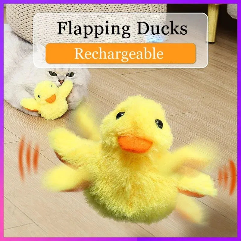 Yellow flapping duck cat toy with USB charging cable on wooden floor