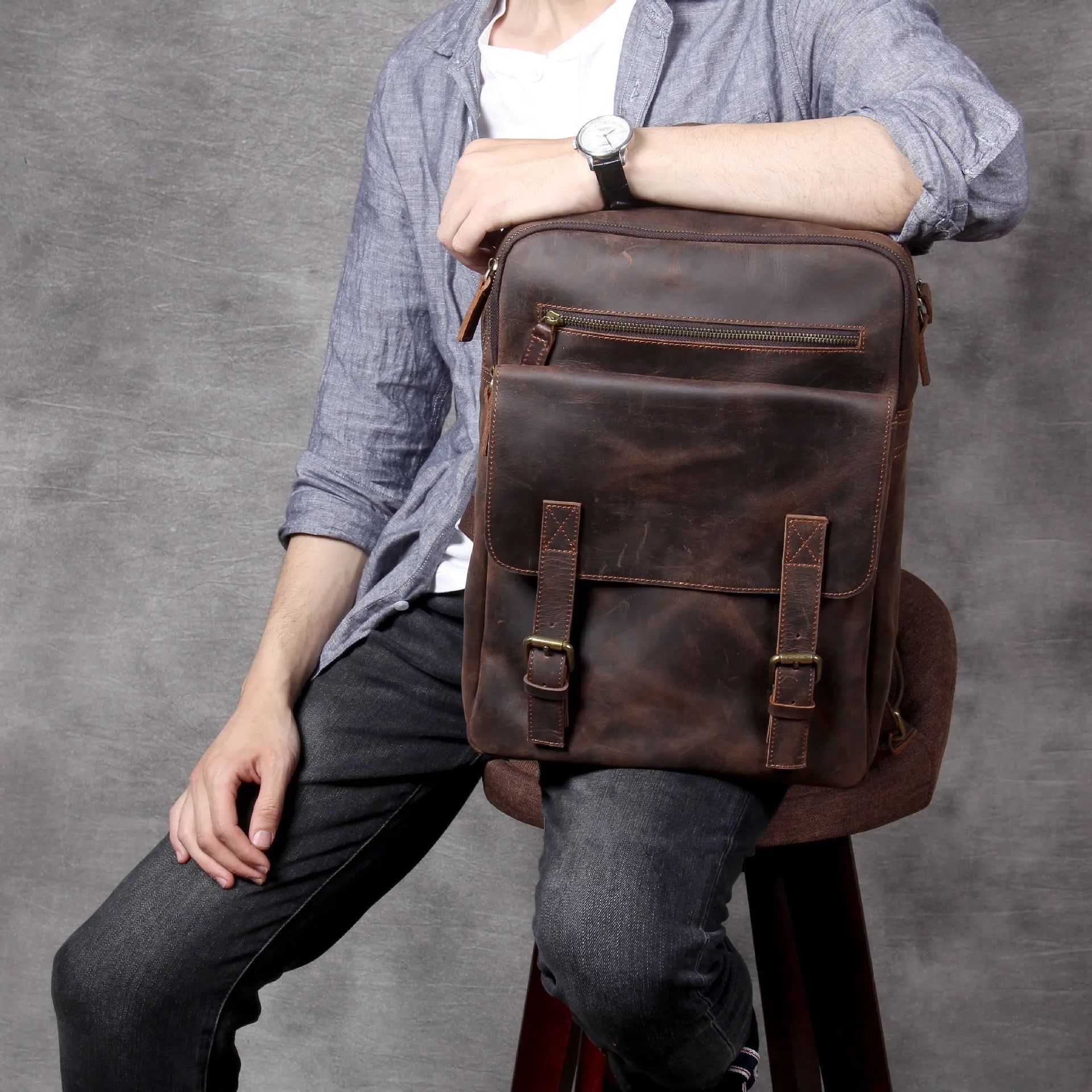 Dark coffee coloured handmade leather backpack with internal organiser compartments.
