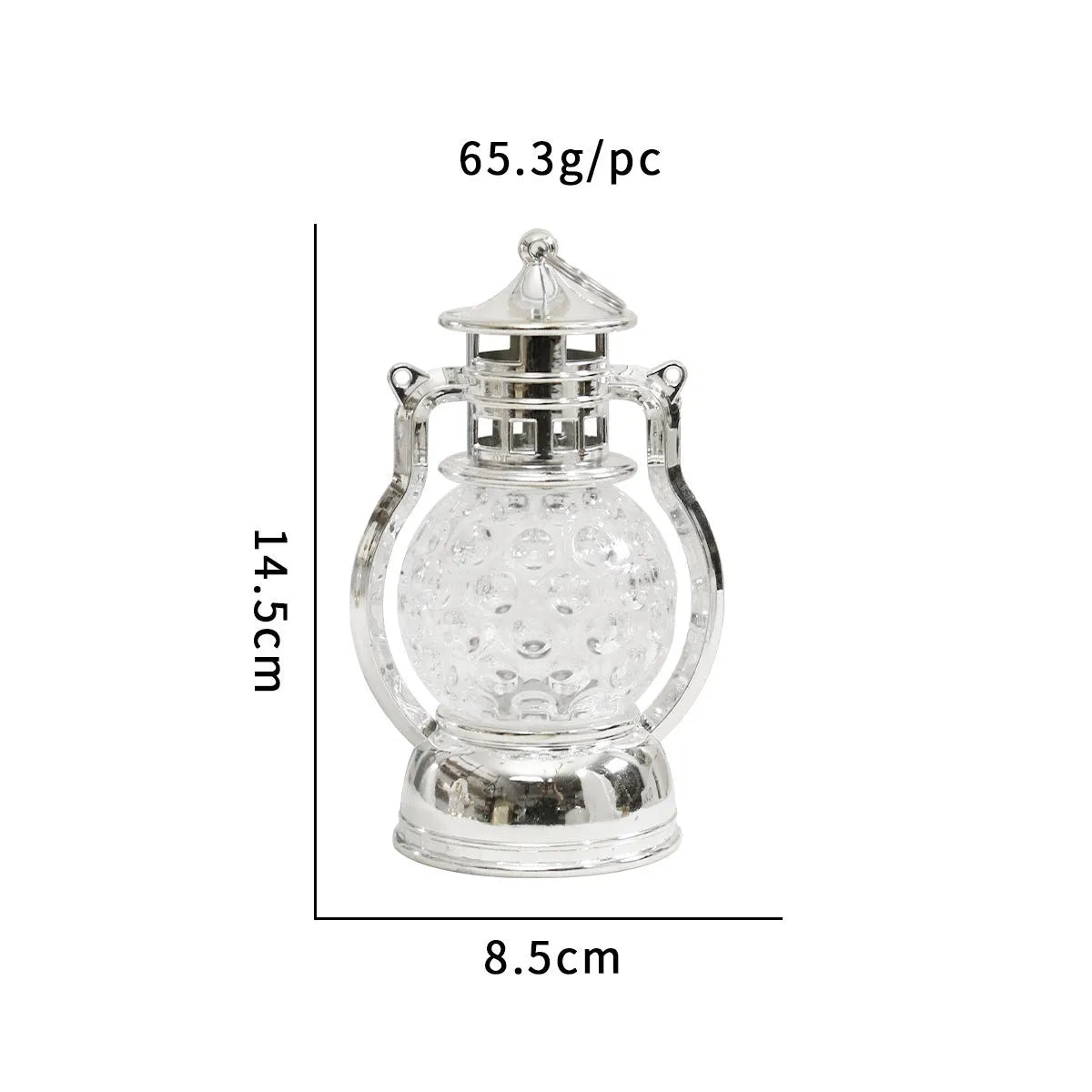 Small retro-style oil lamp LED night light in gold or silver finish on a table.