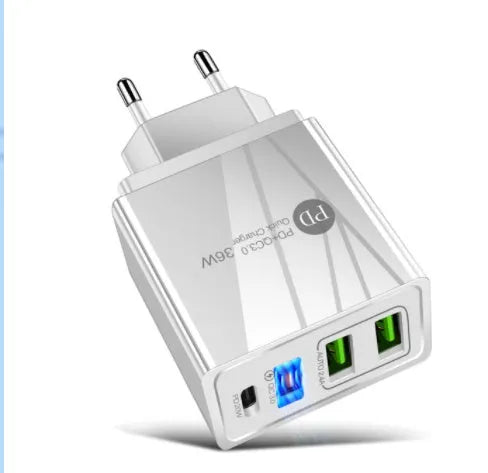 Black and white dual USB travel charger with international plug options showing indicator light