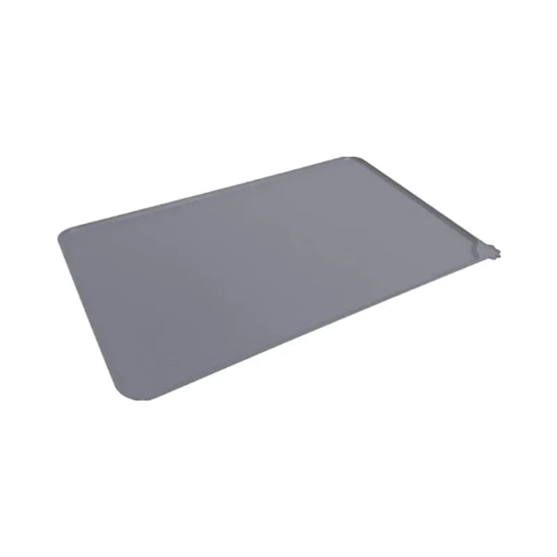 Silicone pet food placemat in blue colour with a raised lip, showing a dog bowl placed on it.