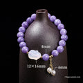 Purple aquamarine chalcedony and agate rabbit bracelet with geometric beads sized 6mm, 8mm, and 12 by 16mm.