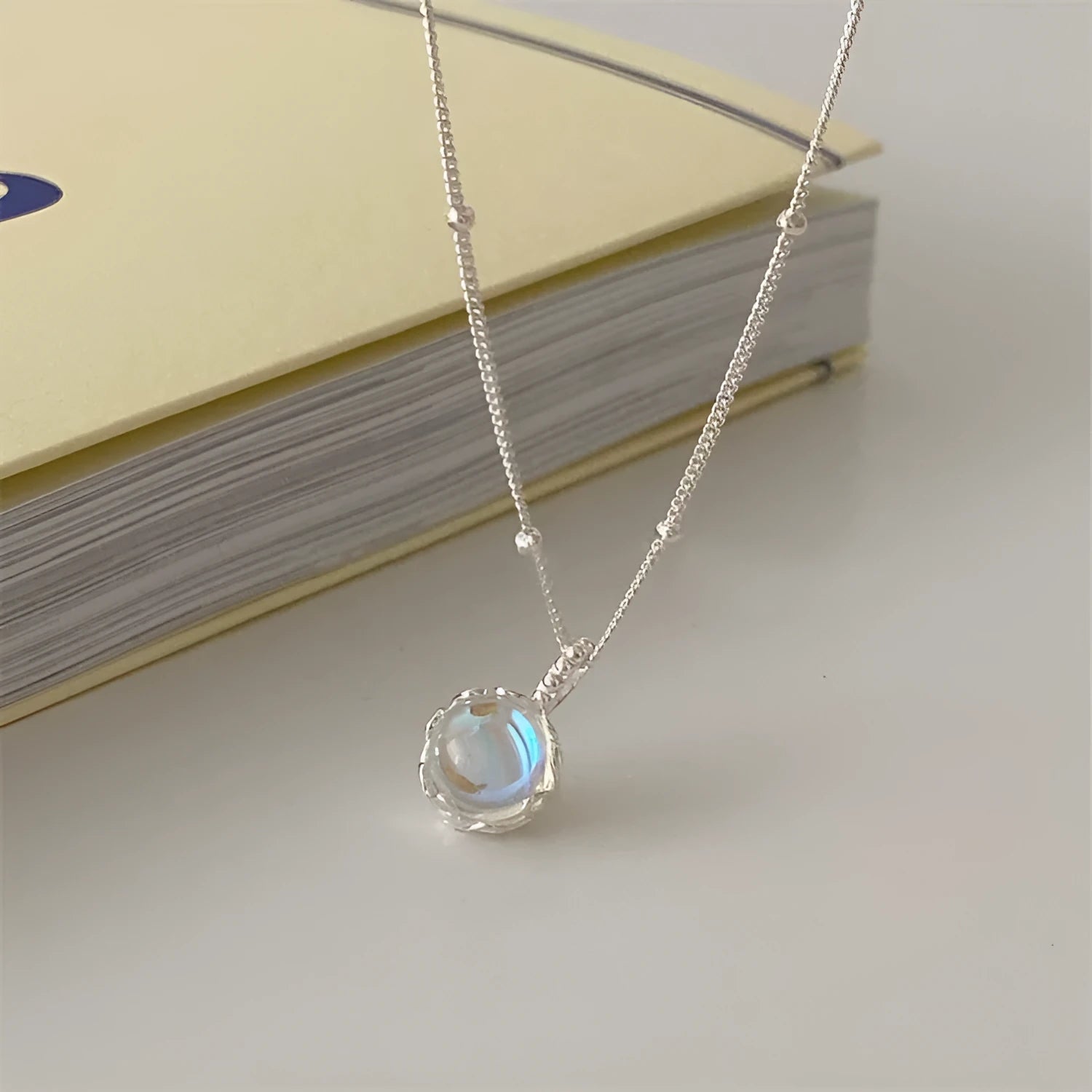 Silver necklace with geometrical stone pendant on a curb chain, adjustable length 41-50 cm.