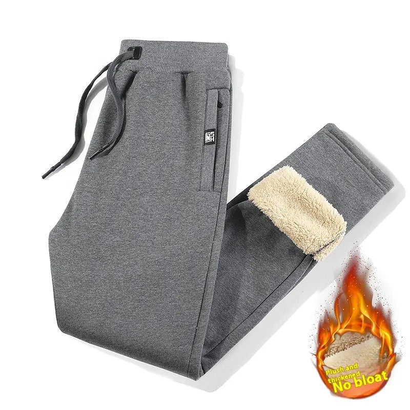 Men's grey fleece-lined cotton track pants with elastic waistband in oversized fit