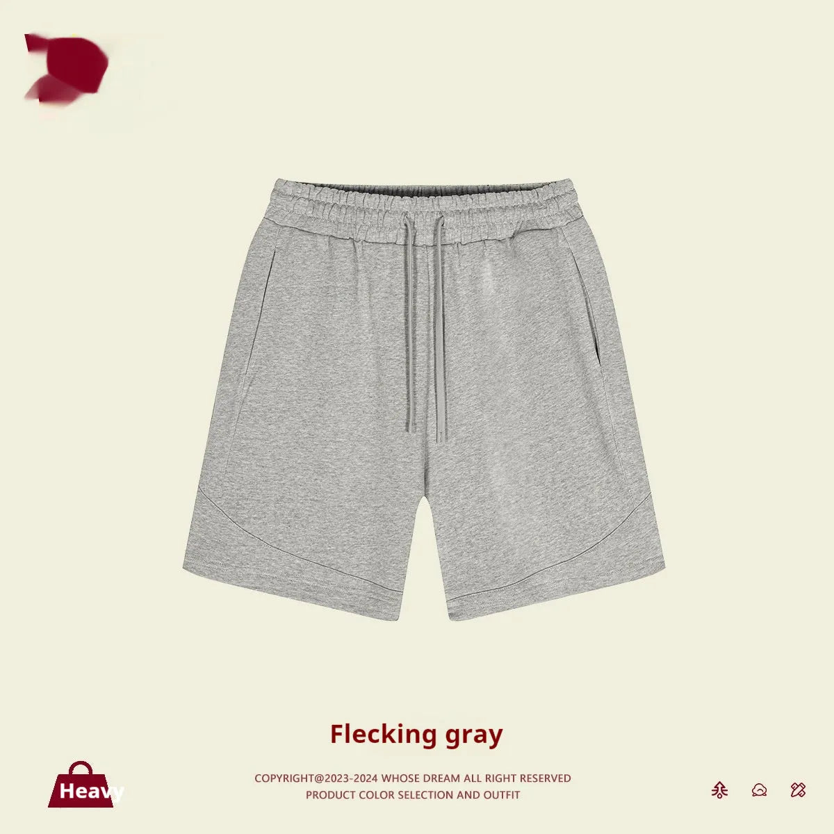 Child wearing solid colour loose cotton sports shorts in a neutral shade.