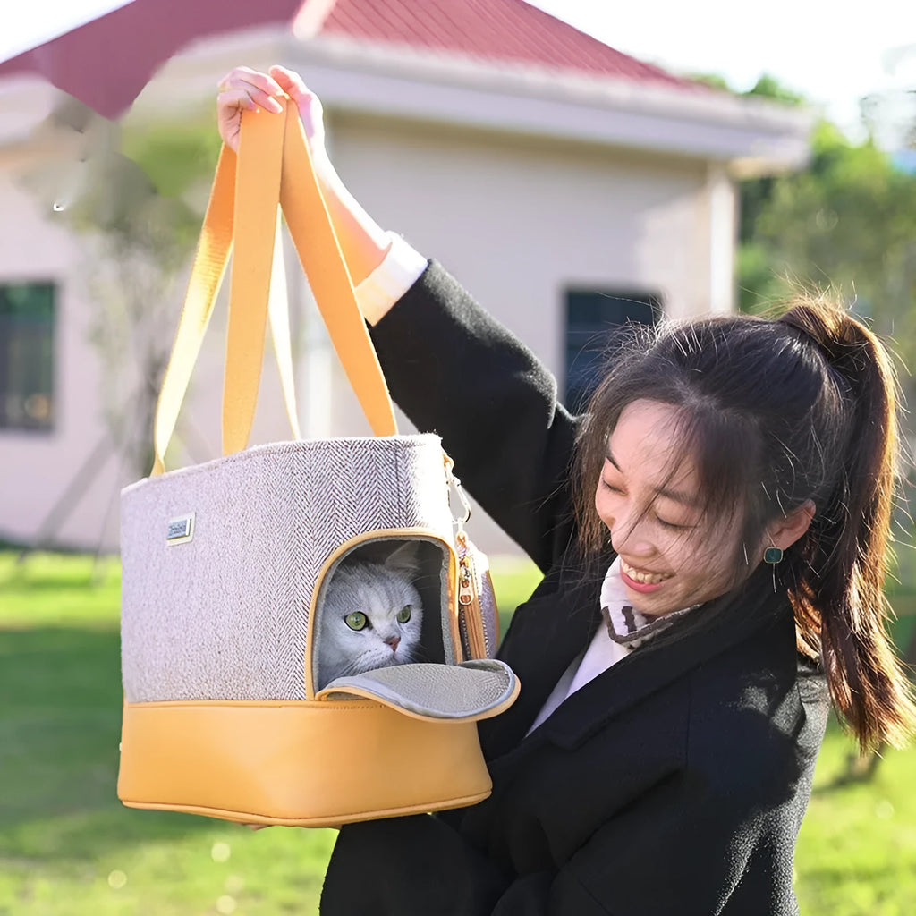 Capsule-shaped pet backpack for cats and small dogs in beige brown colour.