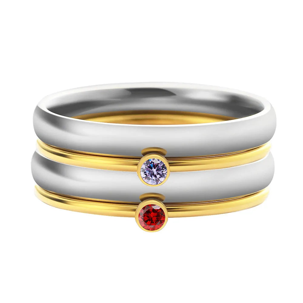 Engraved December birthstone ring in titanium steel with geometric shape on a grey background.