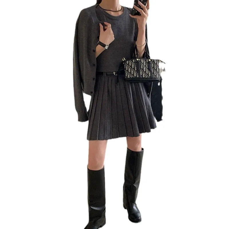 Grey knitted women's two-piece set with vest skirt, long-sleeved cardigan and pleated detail