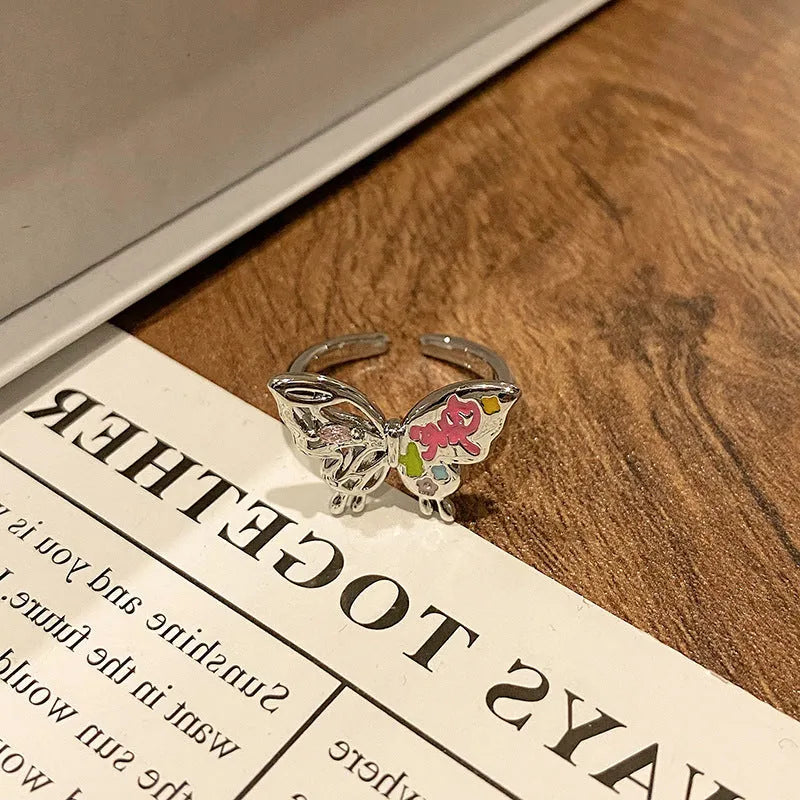 Copper women's ring with Chinese butterfly design and oil-drip finish in simple jewellery style