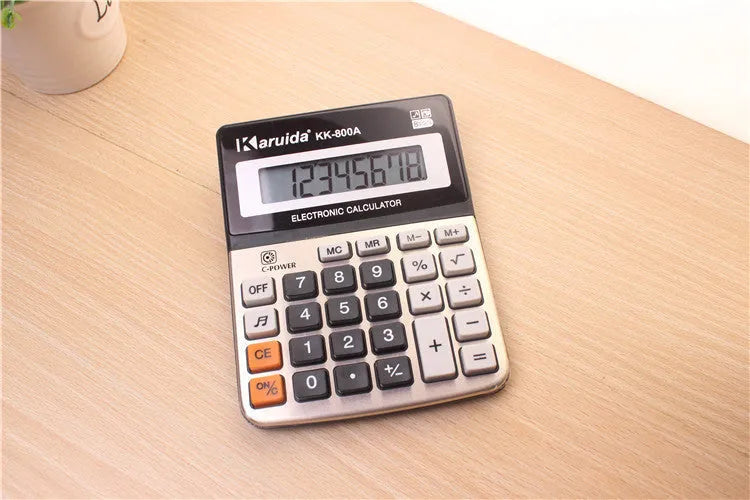 Compact aluminium desktop calculator in silver-grey finish, approximately 14.5cm long, for basic office calculations