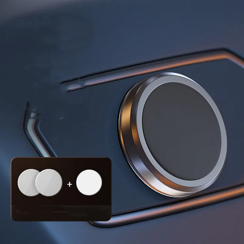 Obsidian black alloy mobile phone holder with magnetic discs on a table