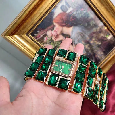 Antique court retro bracelet watch with emerald colored glaze round face and alloy bracelet