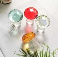 Modern geometric crystal mushroom decoration in transparent, green, red, or yellow, 40 by 53 millimetres.