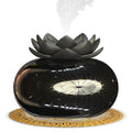Pure black round Lotus aromatherapy humidifier with USB cable on a wooden surface.