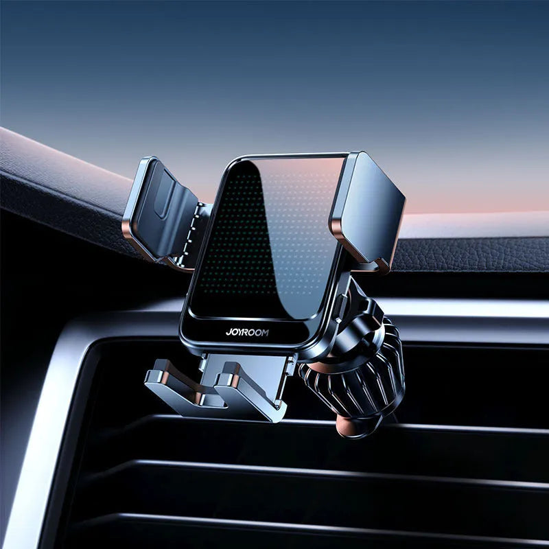 Black car wireless charging phone mount attached to vehicle air vent with phone inserted