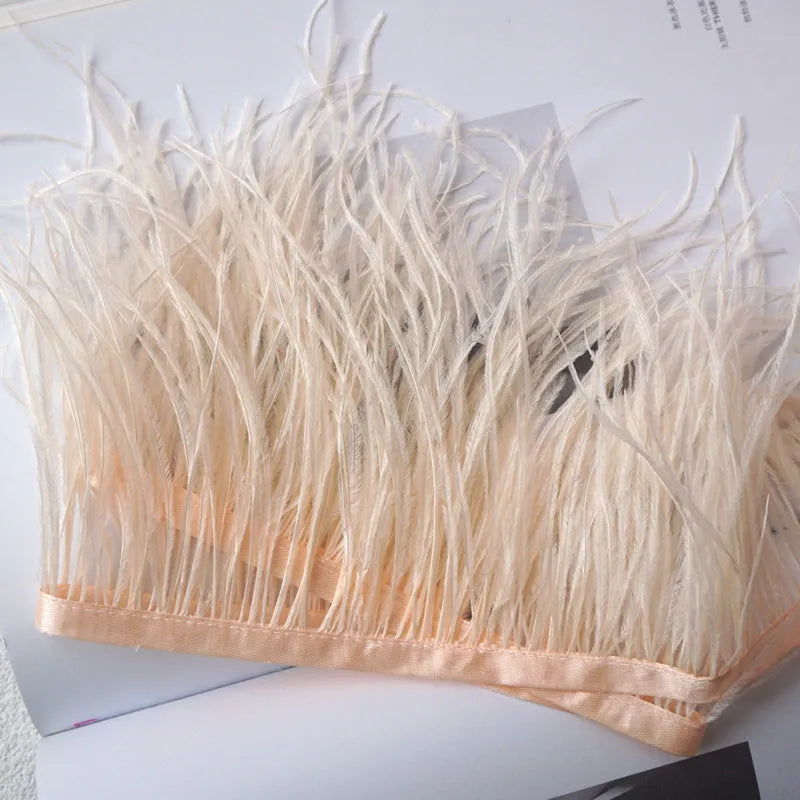 Decorative feather cloth strip in multiple colours including white, black, and mint green for DIY clothing and craft projects
