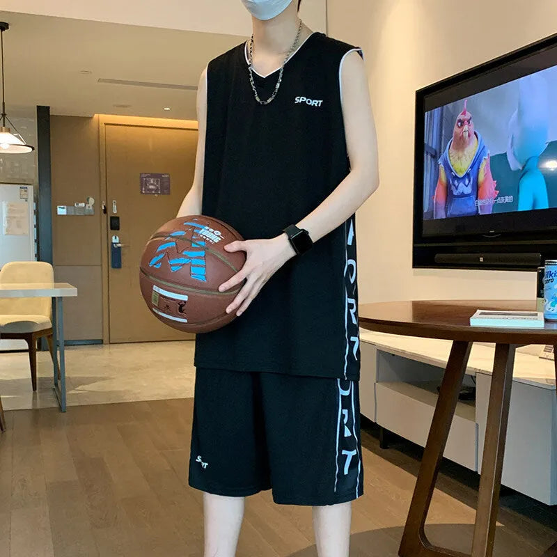 Polyester basketball sports suit with short sleeve vest and matching shorts in various colours