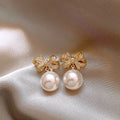 Gold tone bow pearl stud earrings, 12mm alloy women's earrings supplied as one pair