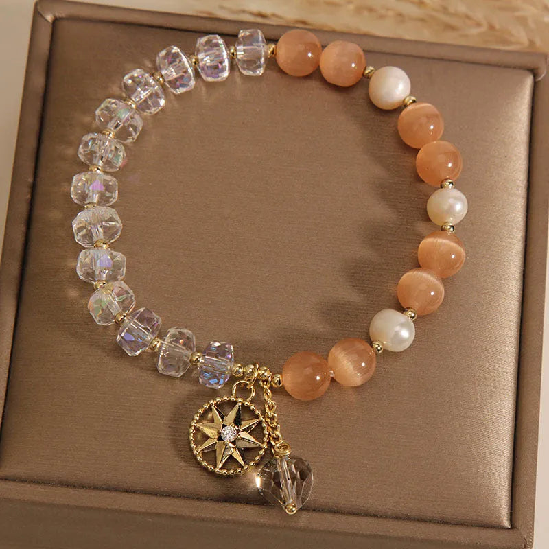 Orange women's bracelet with eight Awn star design featuring opal crystal and artificial gemstone inlay on gold-plated metal