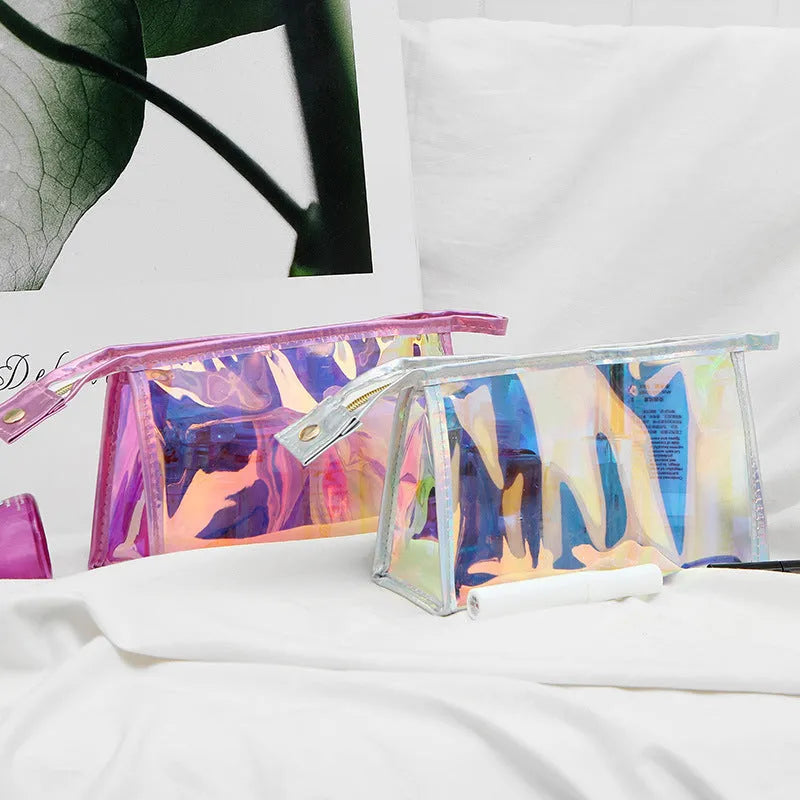 Transparent laser PVC cosmetic bag with zip closure, 22x7x14cm, on a flat surface
