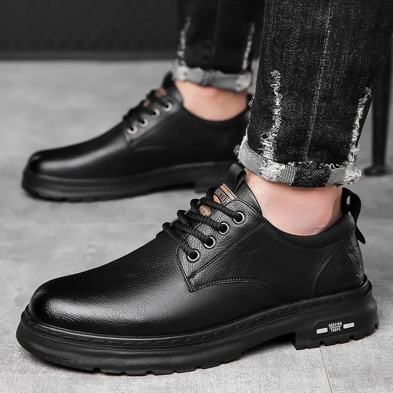 Men's black retro casual leather shoes with round toe and flat square heel on a white background