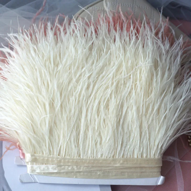 Decorative feather cloth strip in multiple colours including white, black, and mint green for DIY clothing and craft projects
