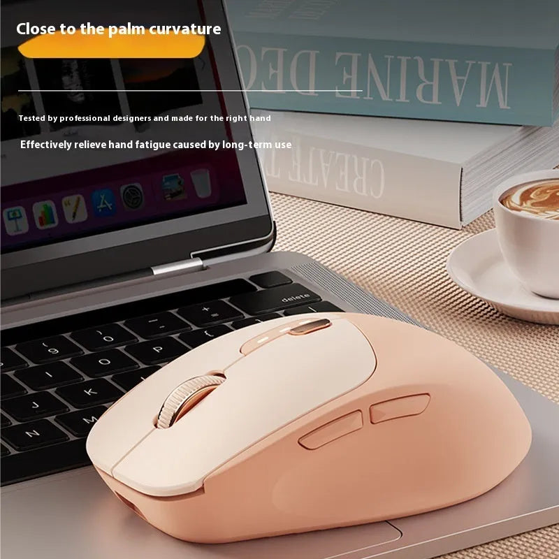 Mute wireless Bluetooth and 2.4GHz computer mouse in Matcha Green colour on a wooden desk