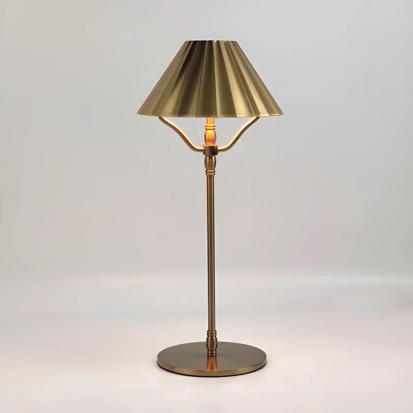 Gold-coloured alloy rechargeable desk lamp with USB-C port and touch dimming switch.