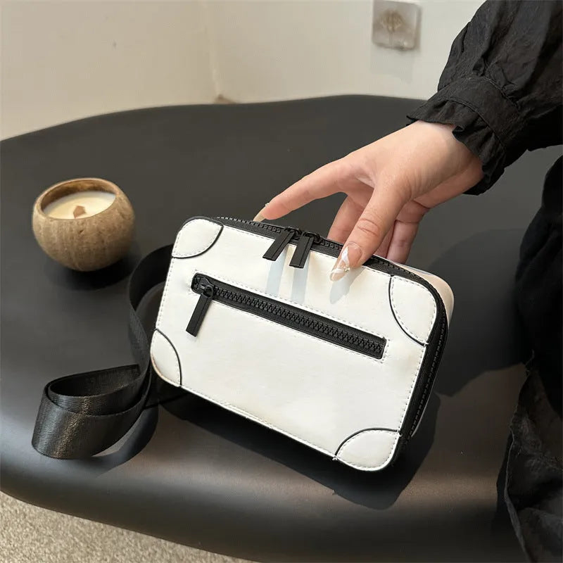 Women's small square crossbody bag in PU leather, horizontal shape, shown in one of five colours with visible sewing lines.