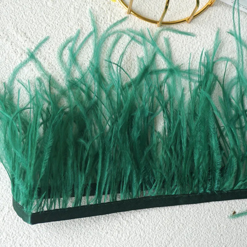 Decorative feather cloth strip in multiple colours including white, black, and mint green for DIY clothing and craft projects