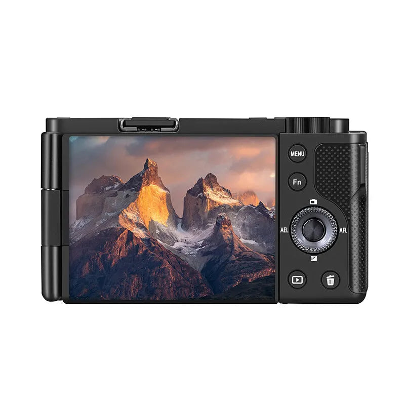 Compact digital camera in black with ultra-wide-angle lens, touch screen, and sling on a white background