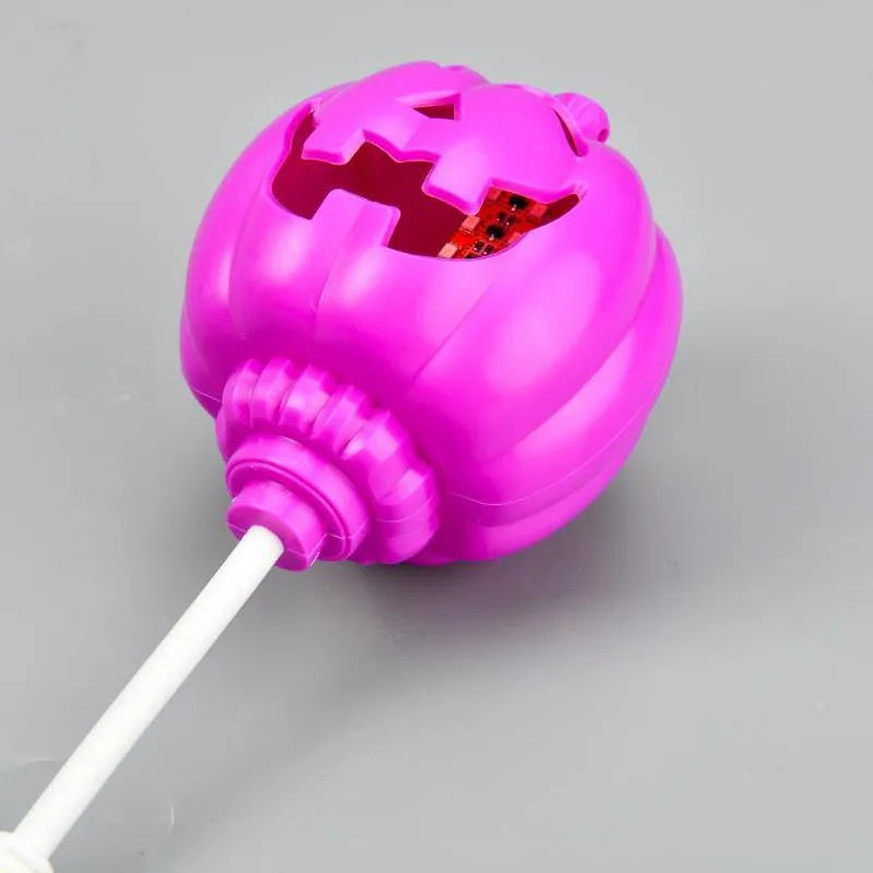 USB rechargeable plastic pumpkin lamp with purple or yellow LED lighting measuring 8.3cm diameter