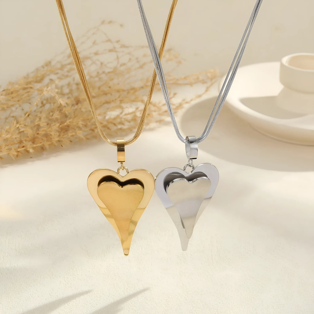 Stainless steel women's necklace with geometric double heart pendant on snake bones chain