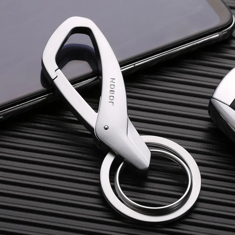 Simple Creative zinc alloy double-ring key chain in black, shown attached to a car key and a belt loop.