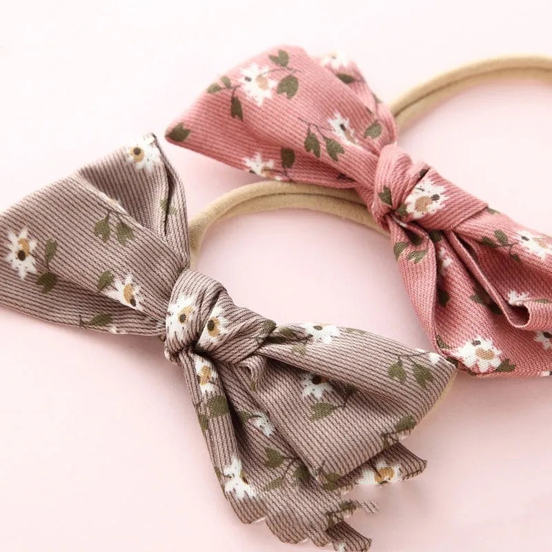 Children's cloth knotted bow hair ring in a Snow White princess design.