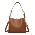 Brown retro-style ladies shoulder bag with single strap showing sewing line detailing and organisational compartments