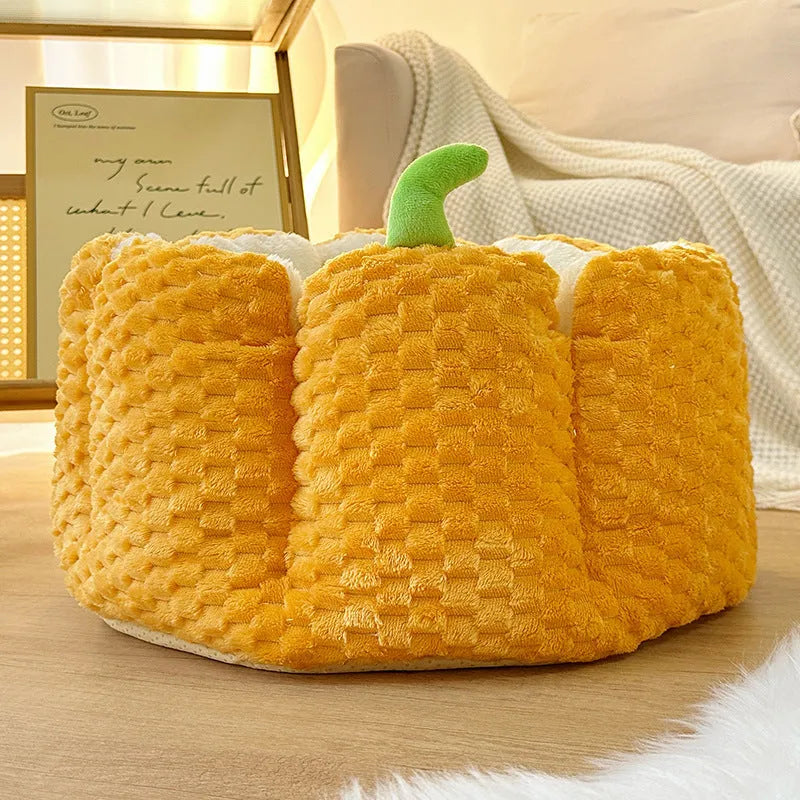 Pumpkin-shaped orange cat nest with raised sides and cotton filling in two size options