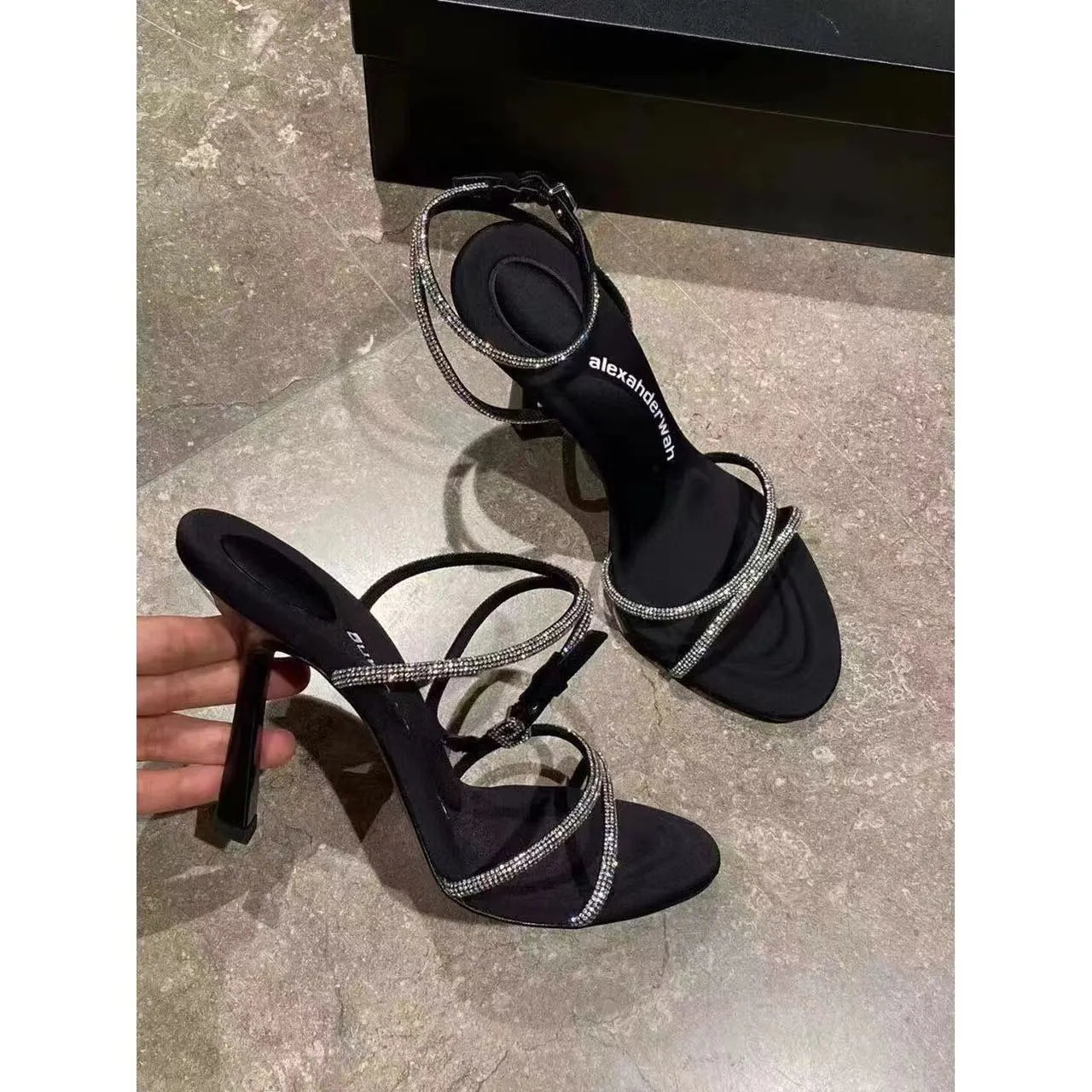 Women's rhinestone cross strap stiletto high heels in black with pointed toe and 9cm heel