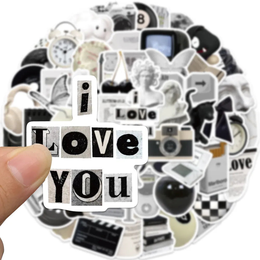 61-piece pack of black and white PVC waterproof decorative stickers laid flat.