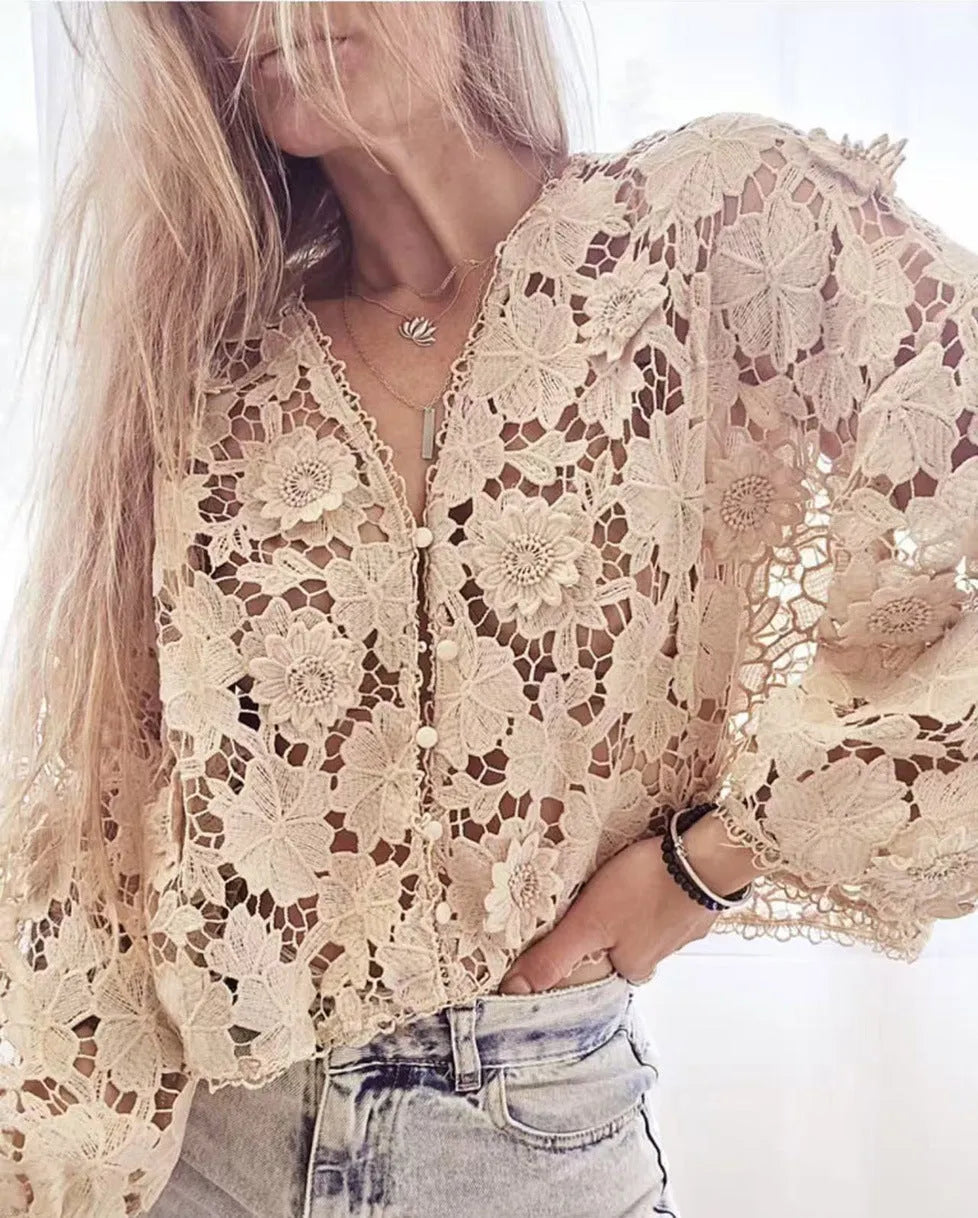 Black loose fit lace cardigan with V-neck and 3D floral decoration on a hanger
